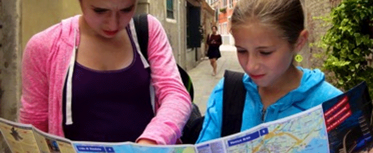 Two girls reading a map
